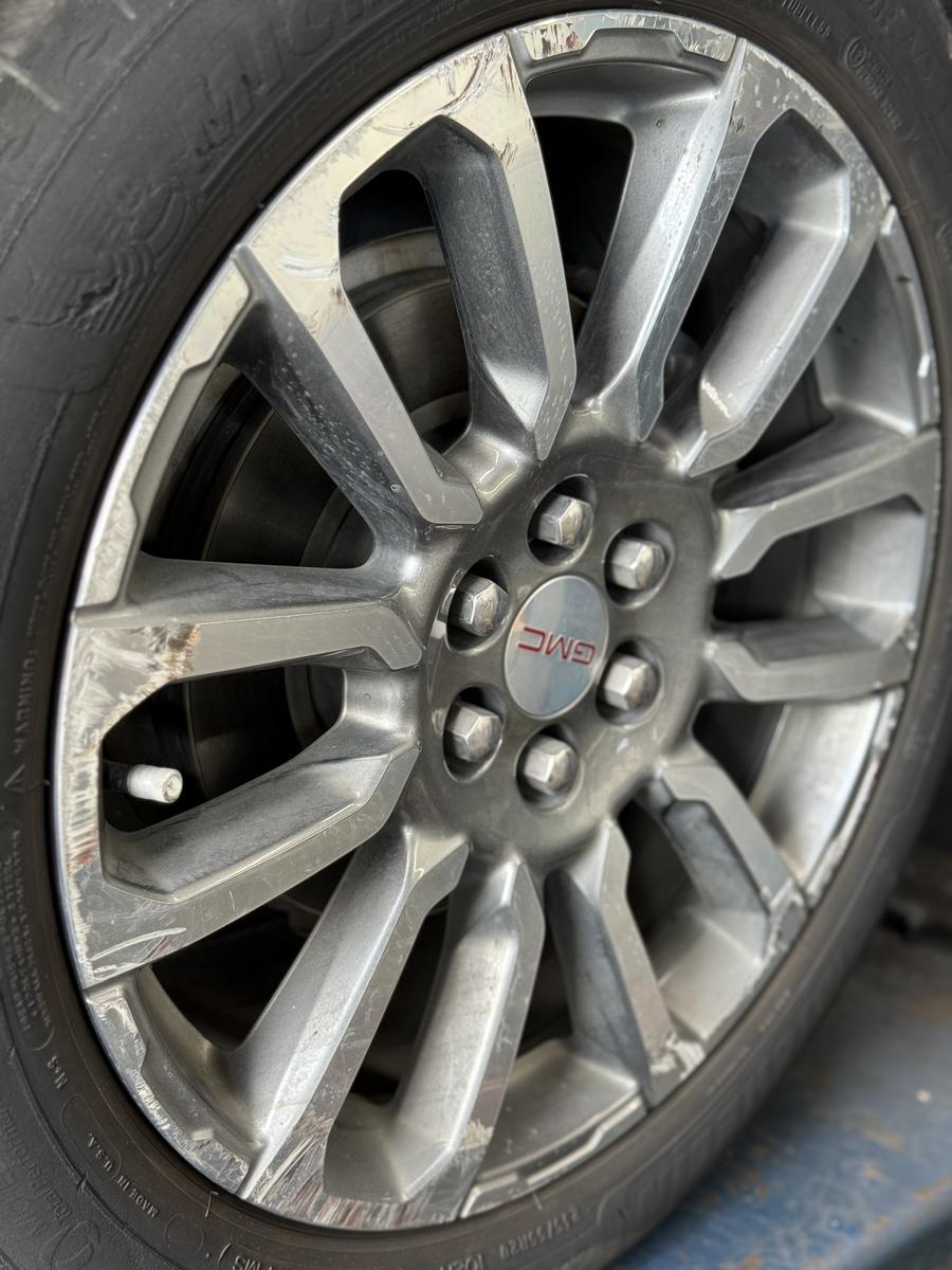 GMC wheel before repair