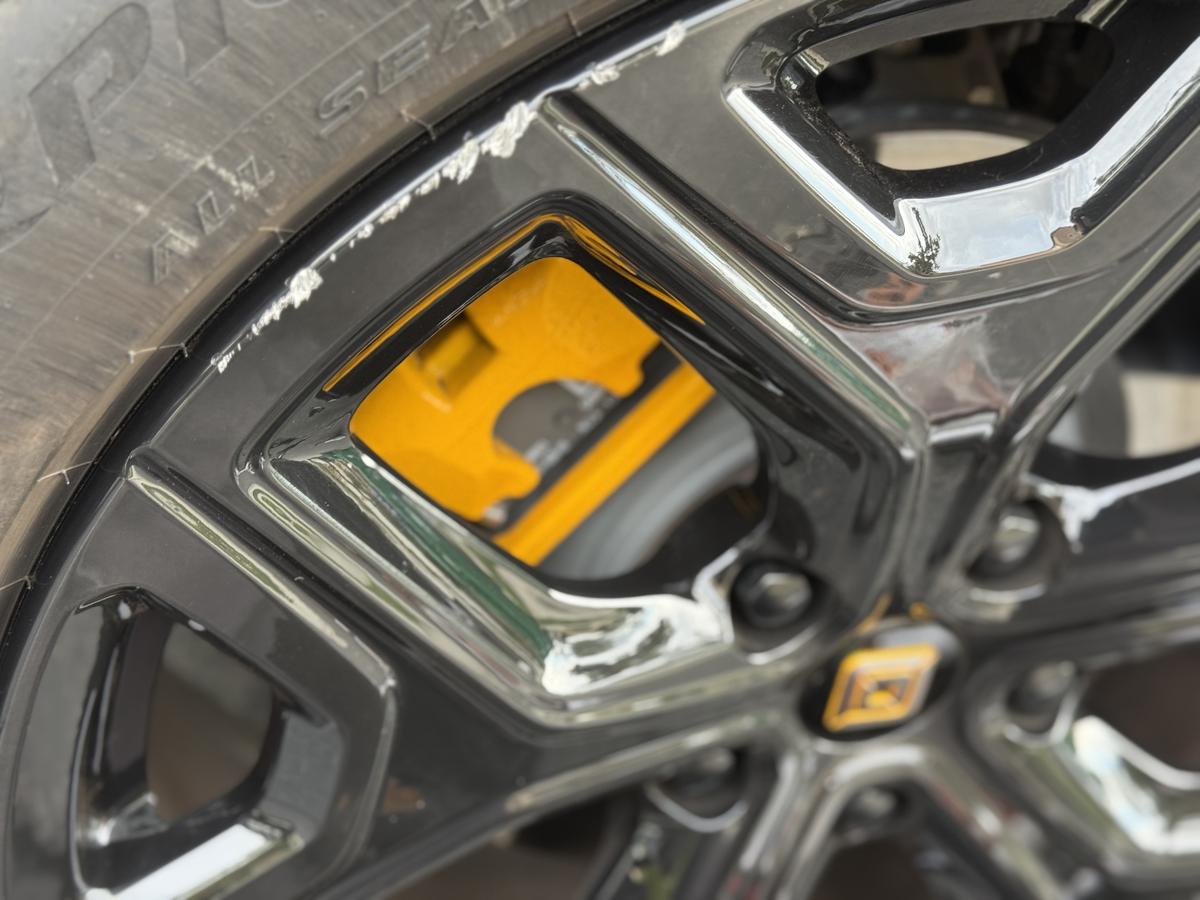 Rivian wheel before repair